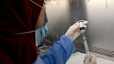A nurse prepares cancer medicine in the pharmacy of Beirut's Rafic Hariri University Hospital on September 15, 2021. For patients to know that a potentially life-saving treatment exists but remains out of reach because of price is intolerable. EPA