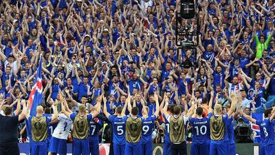 Iceland players applaud the fans after victory over Austria ensured passage into the Euro 2016 knockout stages. Franck Fife / AFP