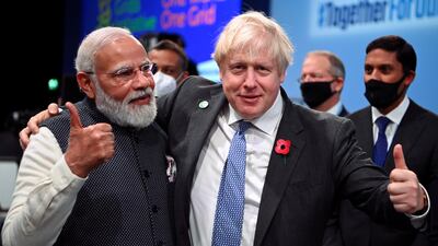 Prime Ministers Narendra Modi and Boris Johnson met at last year’s Cop26 meeting in Scotland. Reuters