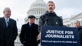 AFP journalist Dylan Collins speaks about the 2023 attack, alongside US senators Chris Van Hollen, left, and Peter Welch, second left. AFP