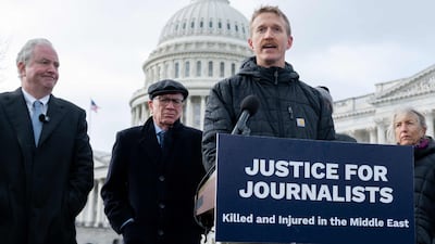AFP journalist Dylan Collins speaks about the 2023 attack, alongside US senators Chris Van Hollen, left, and Peter Welch, second left. AFP