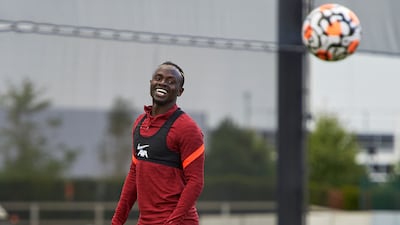 Sadio Mane of Liverpool smiles during a training session at AXA Training Centre in Kirkby, England.