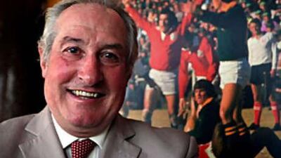 Gareth Edwards beside a picture of himself celebrating a try during the British Lions Tour of South Africa.