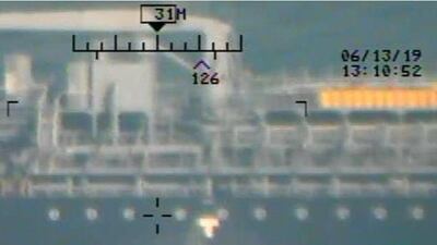 The Pentagon says Iran Revolutionary Guards are seen removing unexploded limpet mine from the M/T Kokuka Courageous.