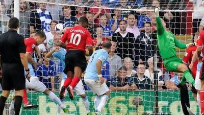 Cardiff City's Fraizer Campbell scores against Manchester City.