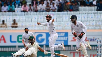 South Africa batsman Temba Bavuma after being stumped by India wicketkeeper Wriddhiman Saha, right, off the bowling of Shahbaz Nadeem. AFP