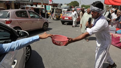 Afghan volunteers collect donations for victims in Jalalabad. AP