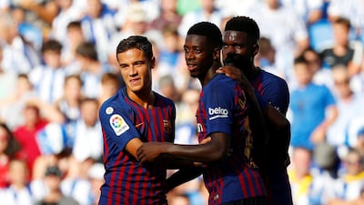 Barcelona's Philippe Coutinho, Ousmane Dembele and Samuel Umtiti celebrate Demebele scoring their side's second goal. Reuters