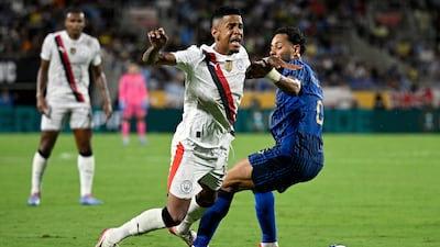 Al Hilal's Renan Lodi challenges Manchester City's Savinho during the seven-goal thriller. AP