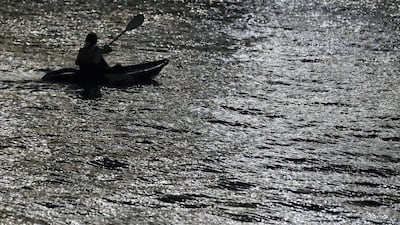 A lone kayaker in the waters around Louvre Abu Dhabi. Chris Whiteoak / The National