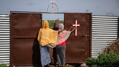 Women leave a Catholic church after prayers at Shagarab camp. Getty
