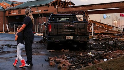 People survey damage to a shopping centre after a tornado touched down in Round Rock, Texas. Reuters