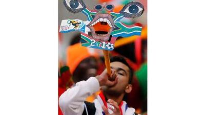 A soccer supporter blows a vuvuzela during the World Cup group G soccer match between Ivory Coast and Portugal at Nelson Mandela Bay Stadium in Port Elizabeth, South Africa.