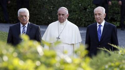 Palestinian president Mahmoud Abbas, Pope Francis and Israeli president Shimon Peres arrive in the Vatican Gardens to pray together at the Vatican on Sunday. Max Rossi / Reuters