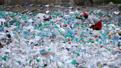 A woman looks for valuables in Port-au-Prince, Haiti. Carlos Garcia Rawlins / Reuters
