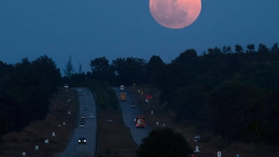 The supermoon rises over a highway near Yangon, Myanmar. Ye Aung Thu / AFP