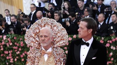 US screenwriter Ryan Murphy (left) arrived in a shimmering high collared cape that was an intriguing blend of Emperor Ming and My Little Mermaid. EPA