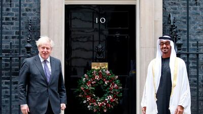 British Prime Minister Boris Johnson (l) greets Crown Prince of Abu Dhabi and Deputy Supreme Commander of the Armed Forces, Sheikh Mohamed bin Zayed, outside 10 Downing Street, London. AFP