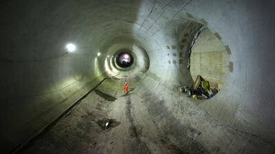 A worker walks through the partially completed Crossrail Bond Street station tunnel. Peter Macdiarmid / Getty Images