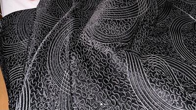 Argentina's Lionel Messi in bed with the World Cup trophy. Reuters