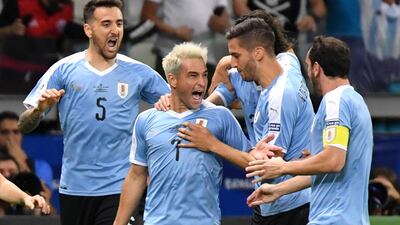 Uruguay's Nicolas Lodeiro (2-L) celebrates with teammates after scoring against Ecuador during their Copa America football tournament group match at the Mineirao Stadium in Belo Horizonte, Brazil. AFP