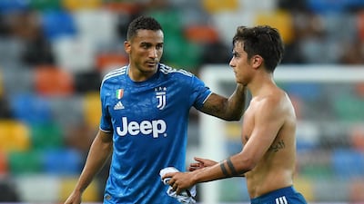 Danilo of Juventus consoles Paulo Dybala after the defeat to Udinese at Stadio Friuli on Thursday. Getty