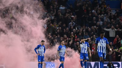 Brighton players react to conceding their second goal. AFP