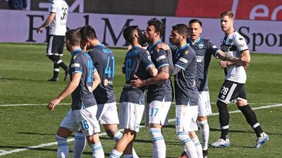 Andrea Petagna (C) celebrates with his teammates. EPA