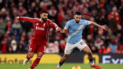 Liverpool's Mohamed Salah and Rayan Ait-Nouri of Manchester City battle for the ball. Getty Images