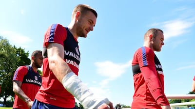 Jamie Vardy and Wayne Rooney of England make their way onto the pitch during a training session at Stade du Bourgognes on June 23, 2016 in Chantilly, France. (Photo by Dan Mullan/Getty Images)