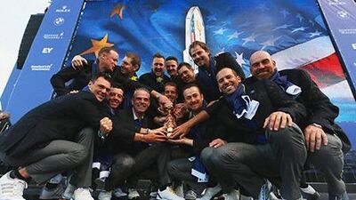 Europe team captain Paul McGinley poses with the Ryder Cup trophy and his team on the PGA Centenary course at the Gleneagles Hotel on September 28, 2014 in Auchterarder, Scotland. Ross Kinnaird / Getty Images