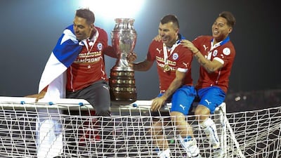 Chilean players celebrate after winning the 2015 Copa America tournament on home soil in Santiago on Saturday. Fernando Bizerra Jr / EPA