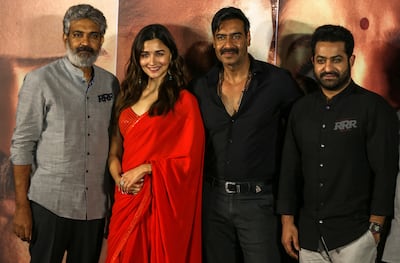 From left, SS Rajamouli with actors Alia Bhatt, Ajay Devgn and NTR Jr at the launch of the trailer of 'RRR' in Mumbai in December 2021. EPA
