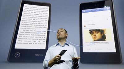 Vladislav Martynov, the chief executive of Yota Devices, presents the new YotaPhone smartphone in Moscow on December 4, 2013. Maxim Shemetov / Reuters