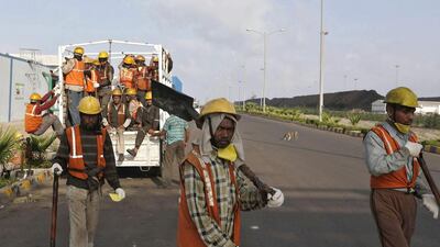 Workers arrive to work at Mundra Port Coal Terminal in the western Indian state of Gujarat. Amit Dave / Reuters