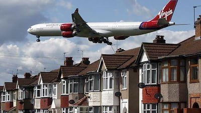 Singapore Airlines is in talks to sell its 49 per cent stake in British carrier Virgin Atlantic. REUTERS / Luke MacGregor