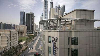 Above, Dubai Media City, one of Tecom's free zones. Silvia Razgova / The National
