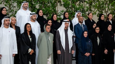 Sheikh Mohamed with members of the team, including Noura Al Kaabi, UAE Minister of State, and Alia Al Qassimi, managing director of the UAE National Orchestra