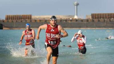 Competitors in the 2009 Abu Dhabi Adventure Challenge emerging from the the water along the Corniche before jumping in kayaks during Day 1 of the race.