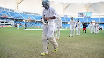 England’s Adil Rashid leaves the field after being the last batsman to be dismissed in the Dubai Test on Monday. Gareth Copley / Getty Images