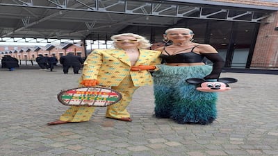 The Gucci show prompted some wild outfits, including this feathered trousers and Mickey Mouse handbag