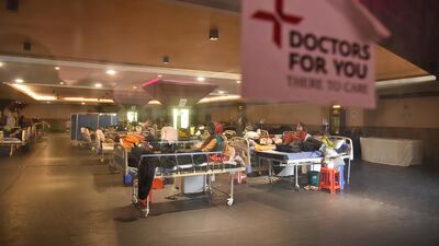 Patients receive treatment inside a Covid-19 center and isolation ward facility near a hospital in New Delhi, India. EPA.