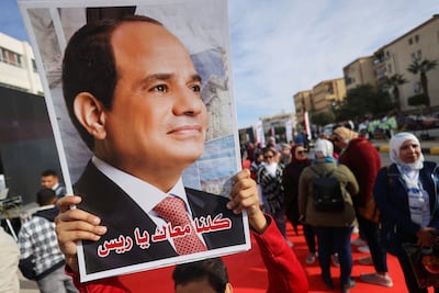 A supporter with a poster of Egyptian President Abdel Fattah El Sisi on the first day of the presidential election in Cairo, Egypt. Reuters