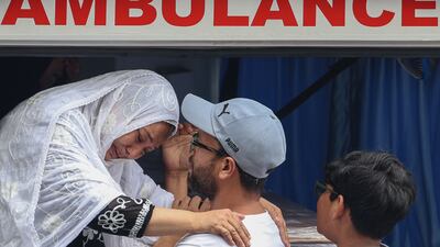 Relatives mourn as they gather to pay tribute to the mortal remains of Javed Ali Syed, a British national originally from Mumbai, his wife Mariam and their children Amani and Zayn, at his residence before their funeral in Mumbai, on June 18. EPA