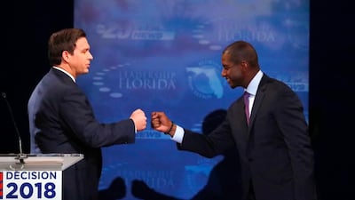 Florida gubernatorial candidates, Republican Ron DeSantis, left, and Democrat Andrew Gillum fist bump after a debate at Broward College in Davie, Florida. AP Photo