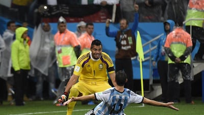 Argentina keeper Sergio Romero, in yellow, celebrates with Maxi Rodriguez after his final successful penalty shot wins it for Argentina in the shootout victory over Netherlands at the 2014 World Cup semi-finals on Wednesday in Sao Paulo, Brazil. Odd Andersen / AFP / July 9, 2014