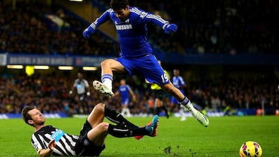 Diego Costa of Chelsea jumps over a challenge from Michael Williamson of Newcastle United during their Premier League match on Saturday. Richard Heathcote / Getty Images