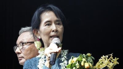 Myanmar pro-democracy leader Aung San Suu Kyi delivers a speech to supporters at the headquarters of her National League for Democracy Party after she was freed from house arrest.