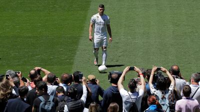 Real Madrid fans take pictures of new sining Luka Jovic. AP Photo