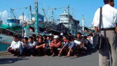 Cambodian fishermen trafficked to work aboard a Thai fishing boat are repatriated from Surabaya, Indonesia.